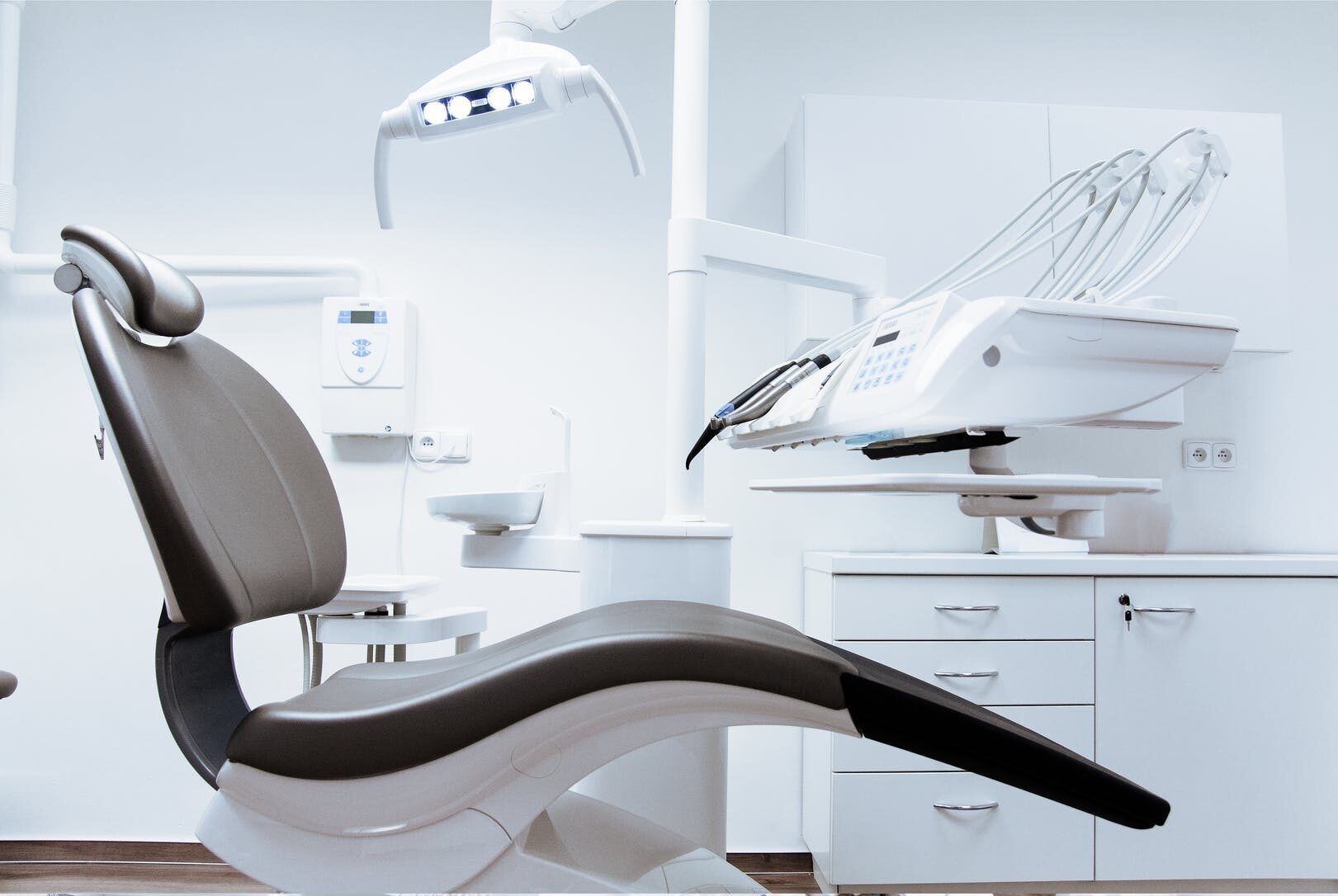 black and white dentist chair and equipment